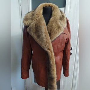 manvelous jacket and coat size Medium new-with tag brow color black line design.